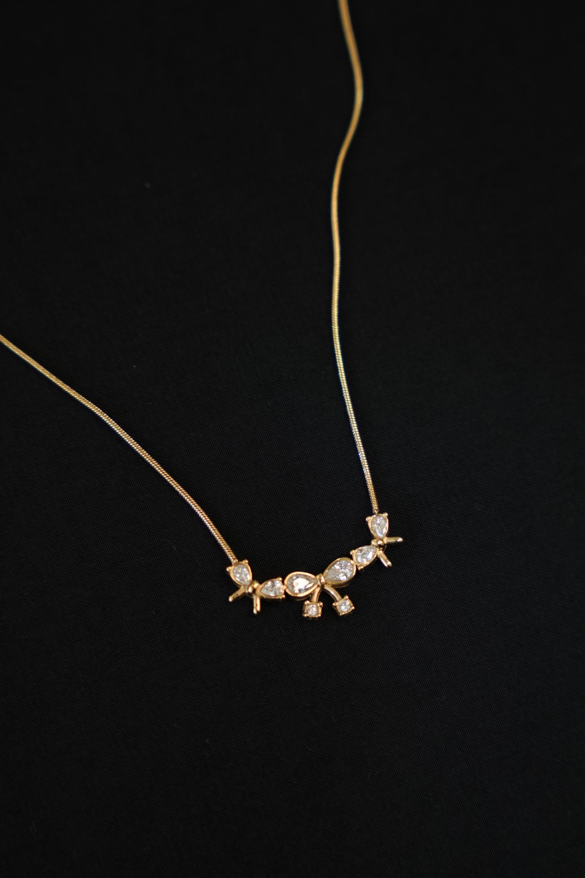 BANDHINI-GOLD TONE CLEAR STONE CHAIN
